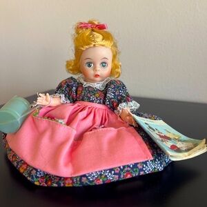 Madame Alexander Collectible doll with blue pale. “Little Women”.